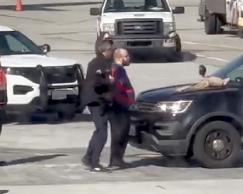 Man detained at LAX after allegedly opening plane emergency door - Vimarsana News