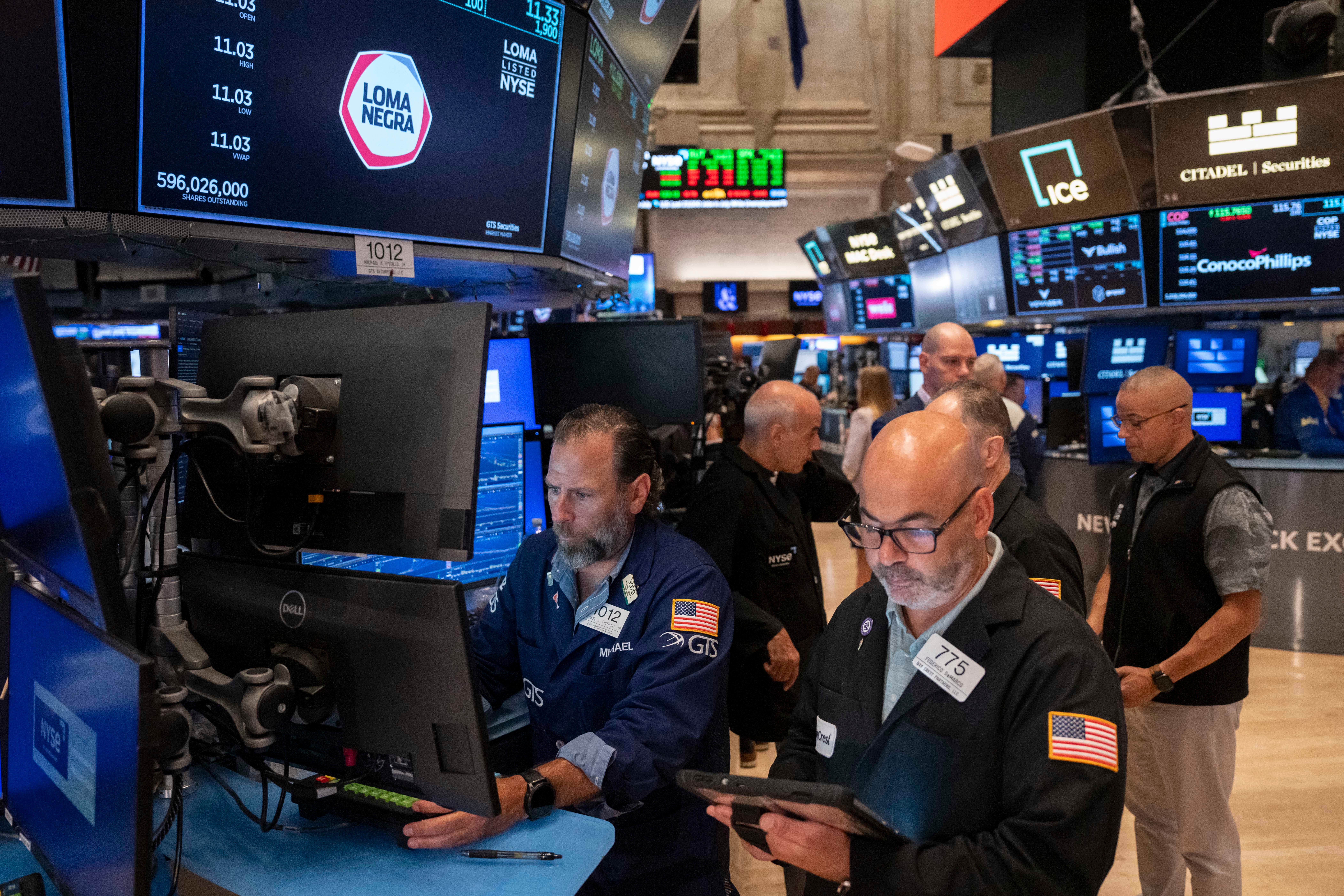 Wall Street rises near a record as AI stocks climb and worries about inflation ease