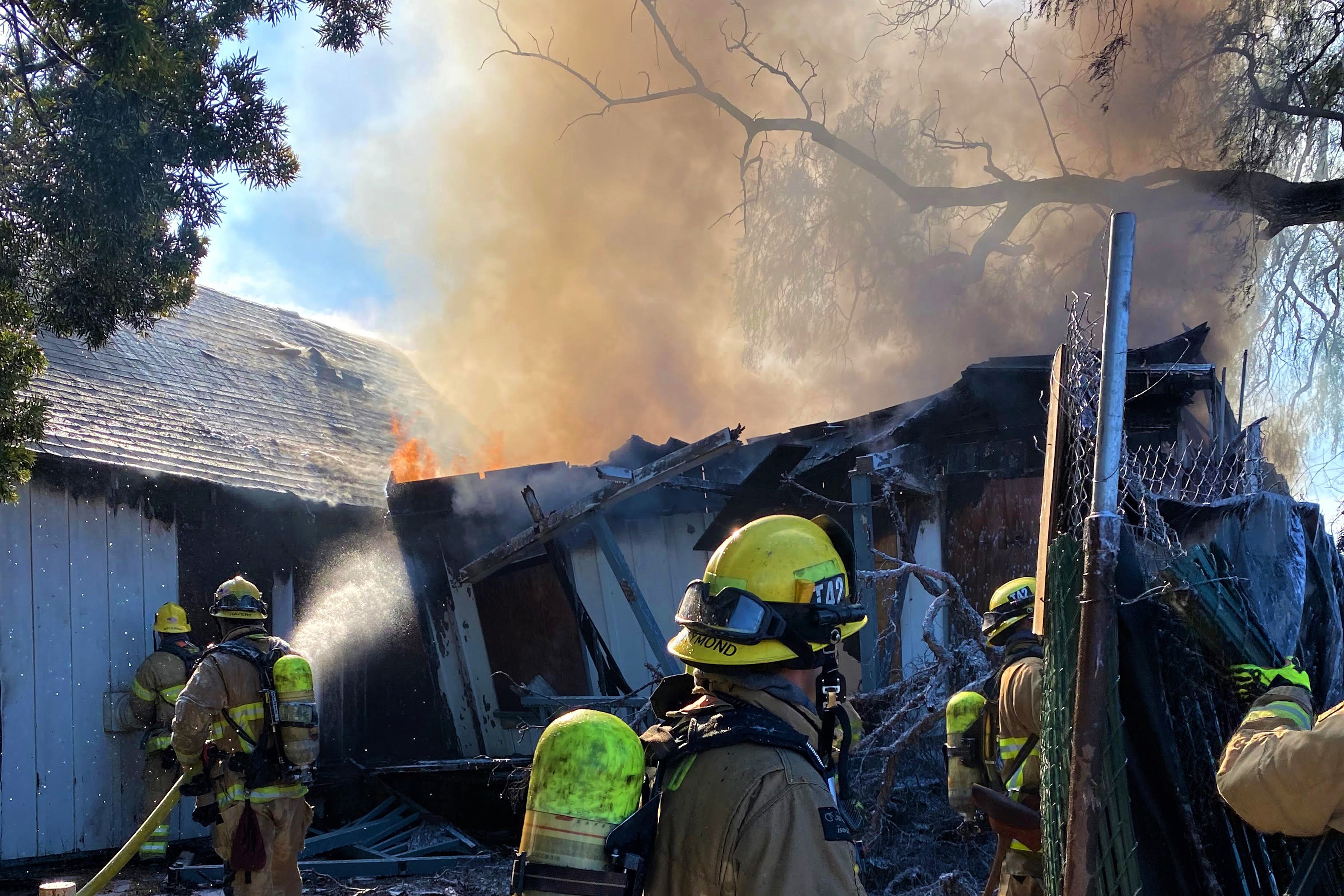 Huntington Beach firefighters battle 2 separate structure fires at condo complex, historic site - Vimarsana News