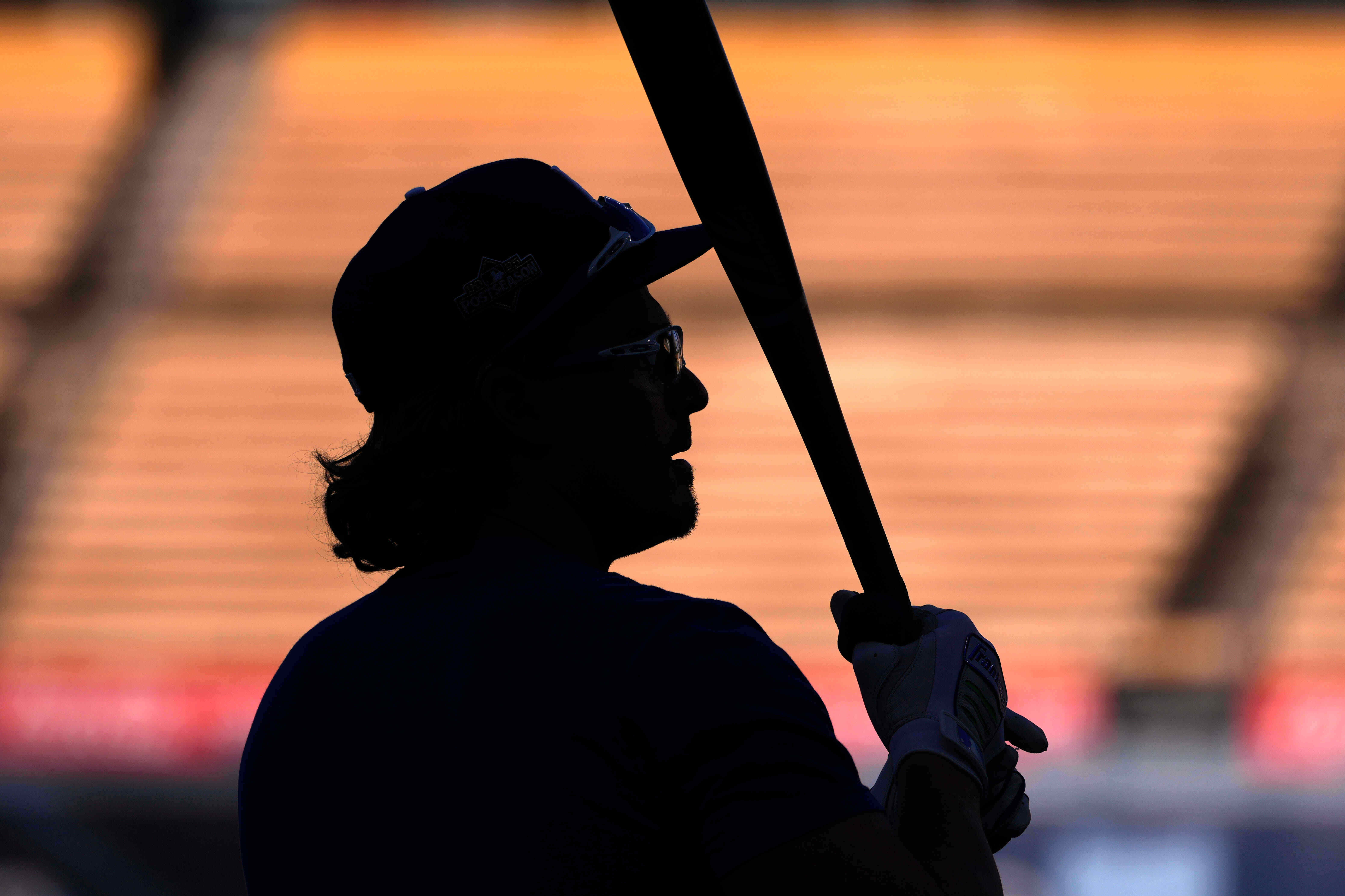 Kike Hernandez of the Los Angeles Dodgers warms up during training prior to Game 3 of the National League Championship Series against the Milwaukee Brewers, Wednesday, Oct. 15, 2025, in Los Angeles.